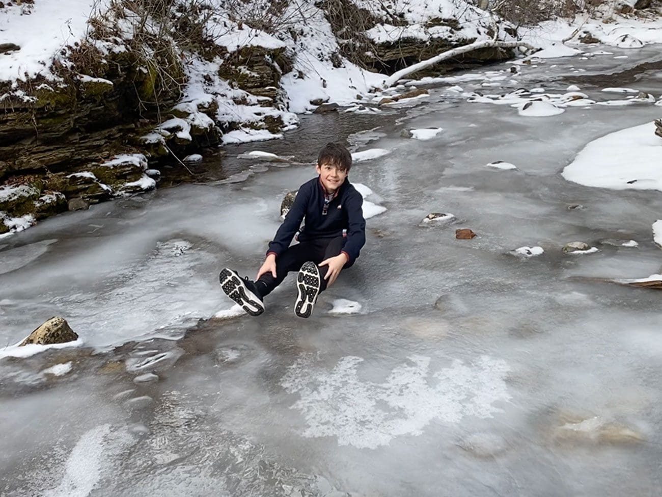 Boy falls on ice on Devil's Bathtub Trail in Spearfish Canyon