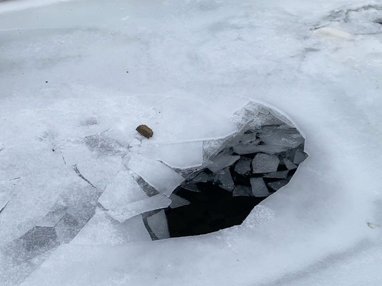 Hole in ice on Devil's Bathtub Trail