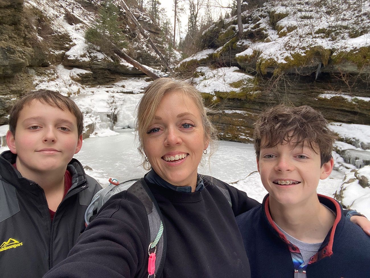 Family photo while hiking at Devil's Bathtub Trail in Spearfish Canyon