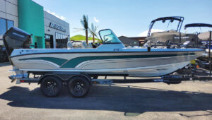 Recreation Station building front with motor boat for sale.