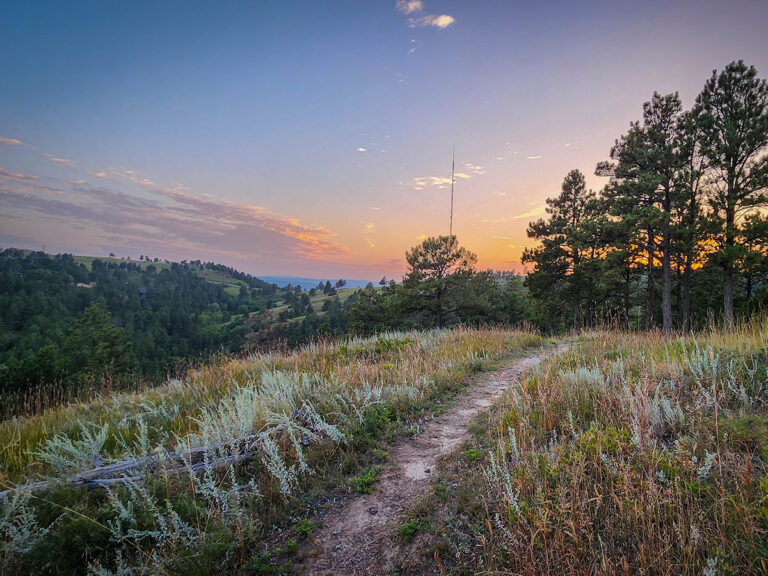 Black Hills bicycle trail at the top of a hill during sunset