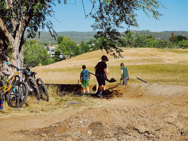 Youth building a bike trail in the Black Hills