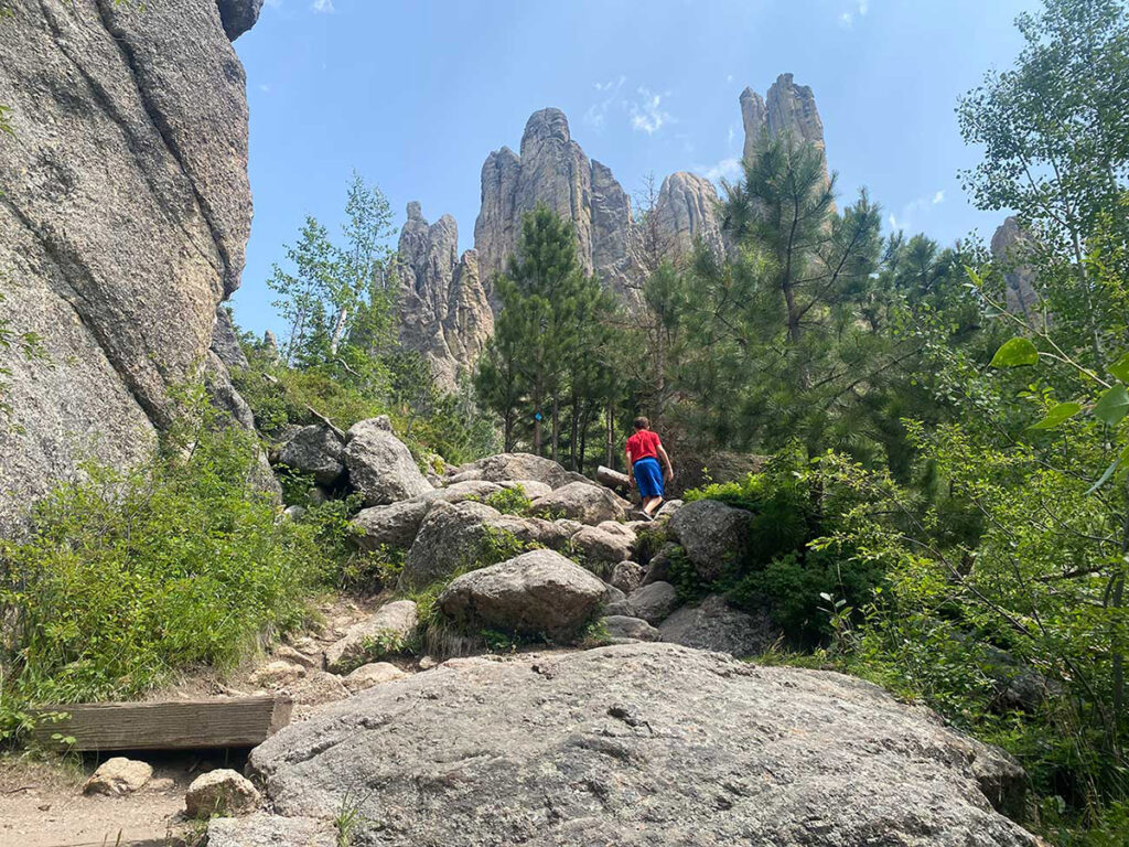 Cathedral Spires Trail in Custer State Park. Climbing boulders on path.