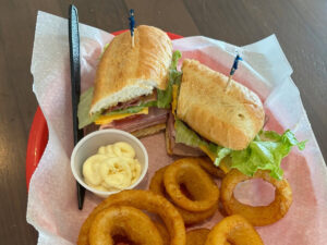 Sandwich and onion rings at The Clubhouse of Spearfish