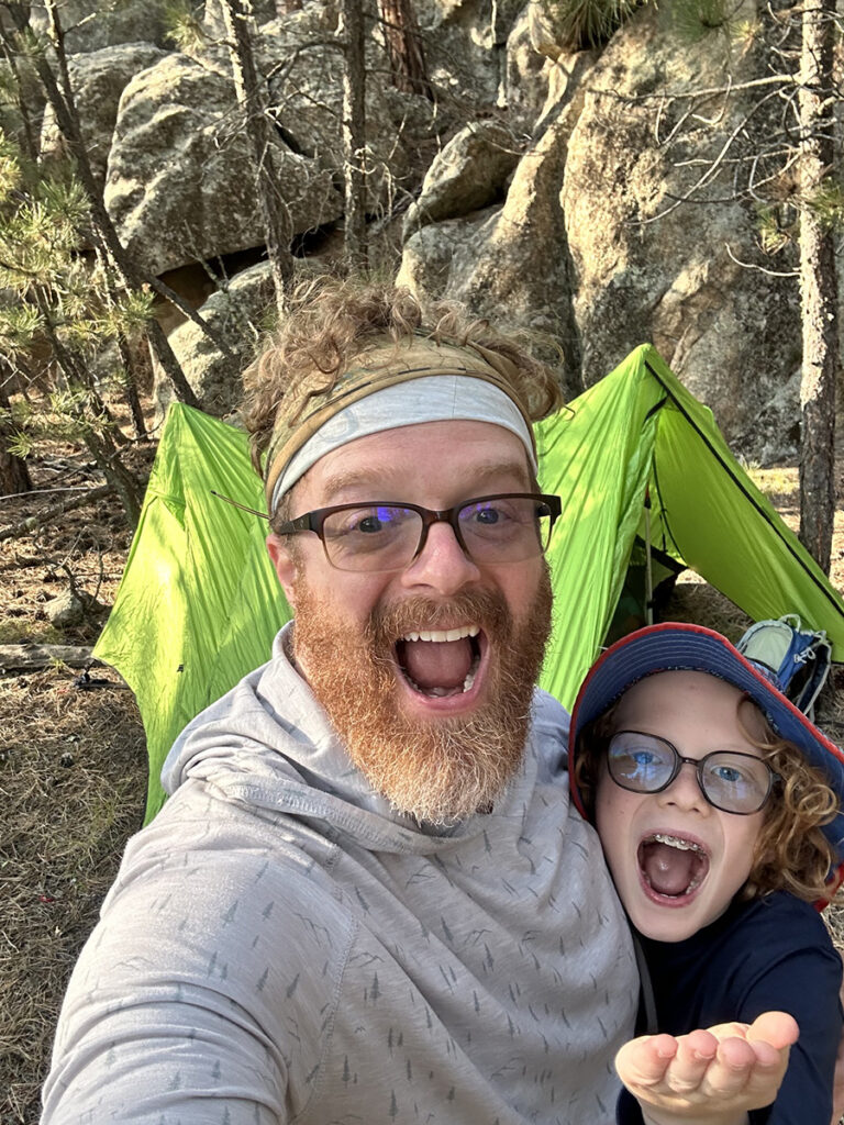 Logan S. backpacking with son.