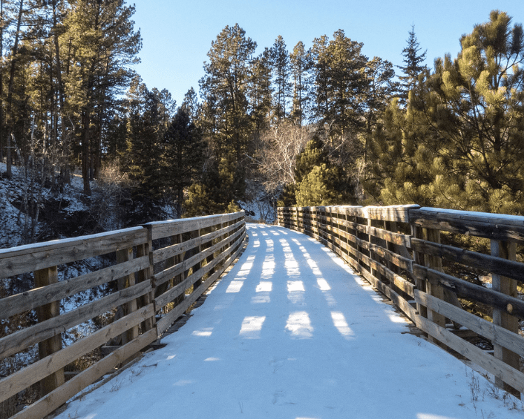 Mickelson Trail - Hill City Trailhead snowy wooden pathway