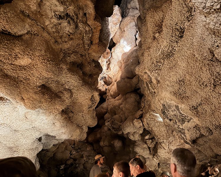 Cave formation in Jewel Cave above a group of people